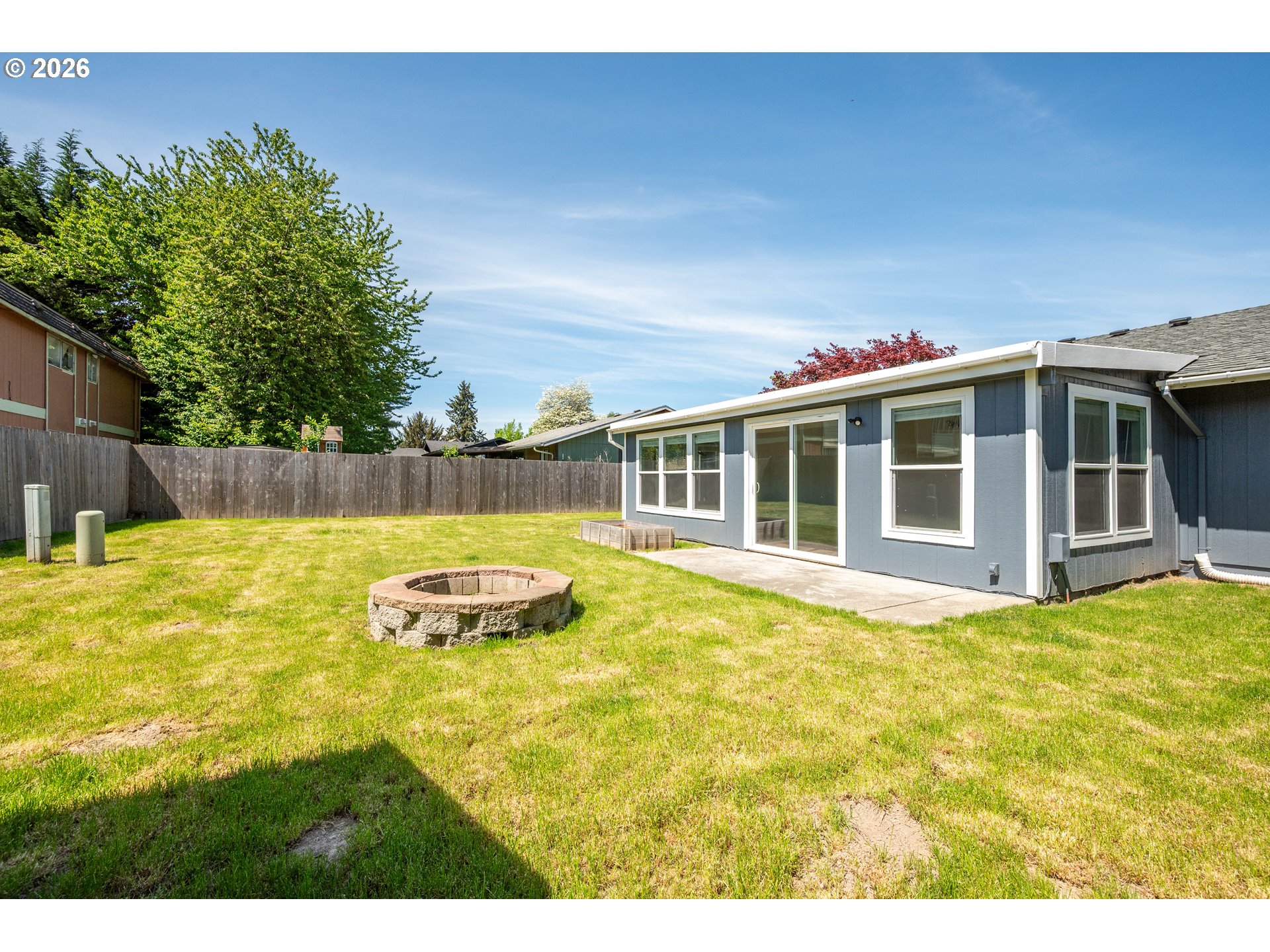 4703 Merlin Street Longview, WA 98632 - Photo 21 of 25 a view of a house with a swimming pool