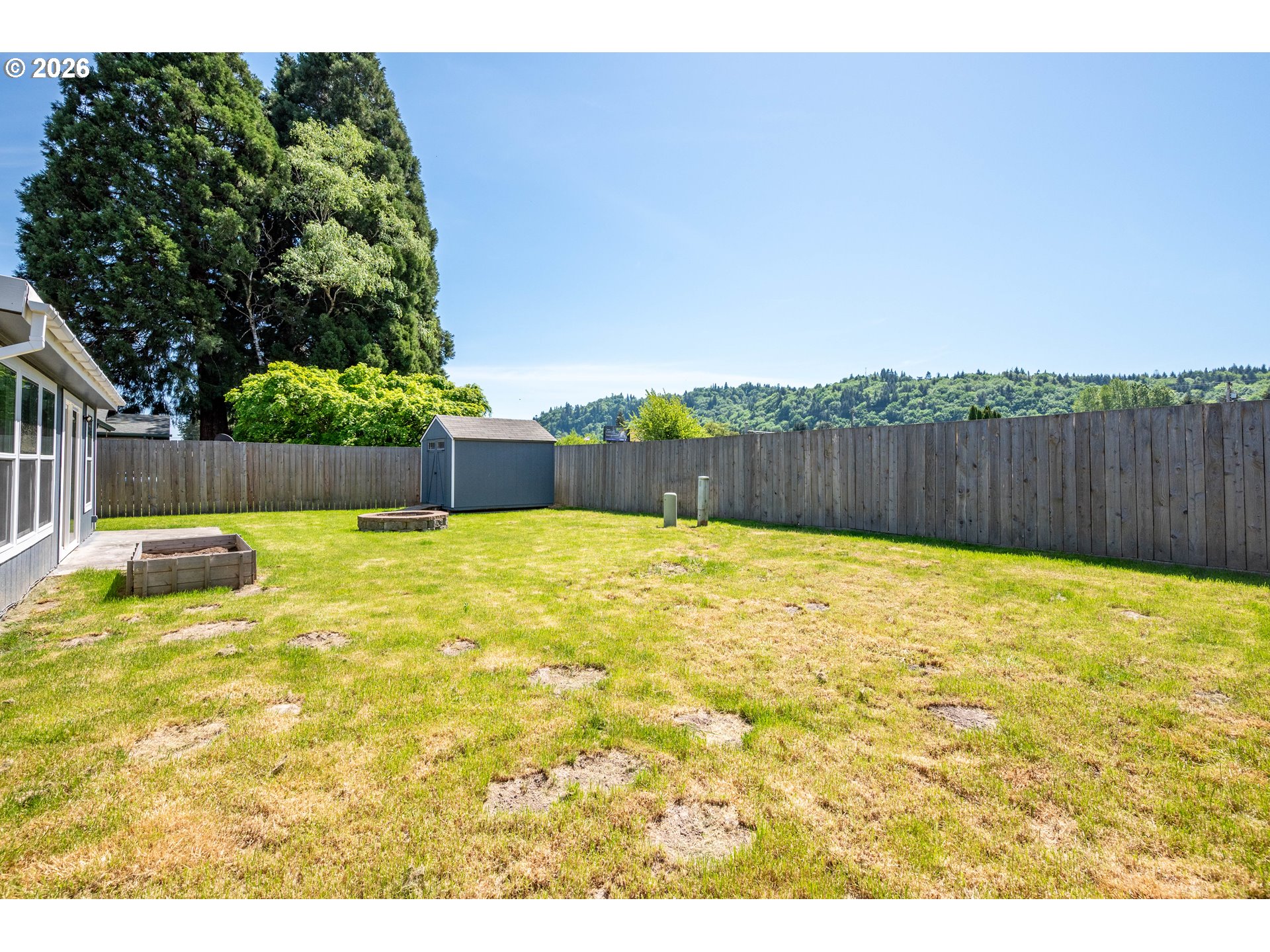4703 Merlin Street Longview, WA 98632 - Photo 22 of 25 a swimming pool with wooden fence