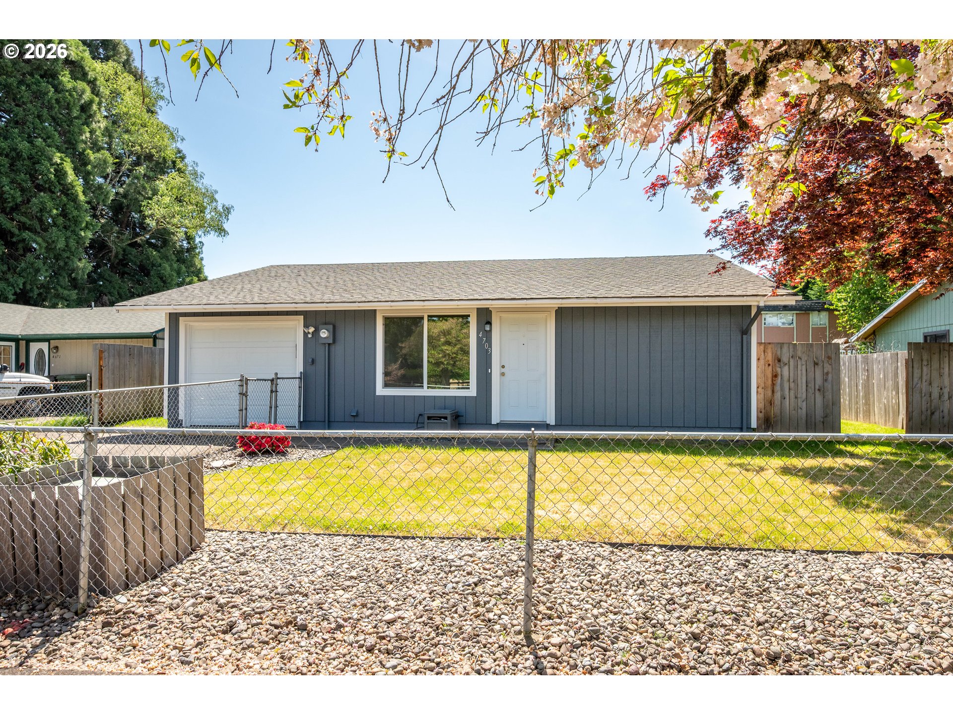 4703 Merlin Street Longview, WA 98632 - Photo 3 of 25 a view of a house with pool and a yard