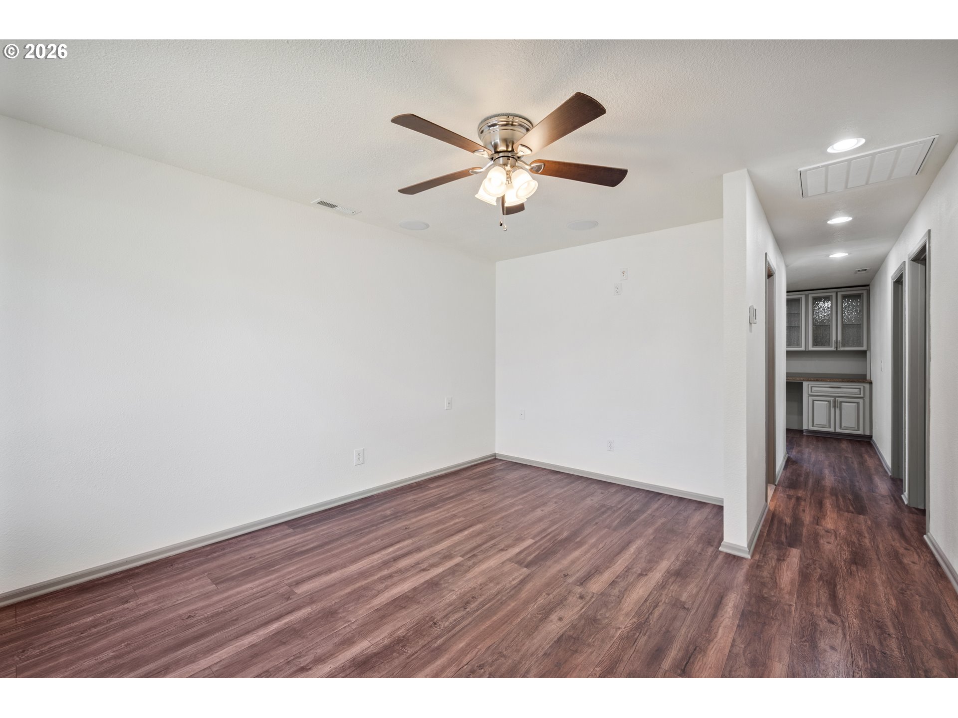 4703 Merlin Street Longview, WA 98632 - Photo 5 of 25 a view of an empty room and wooden floor