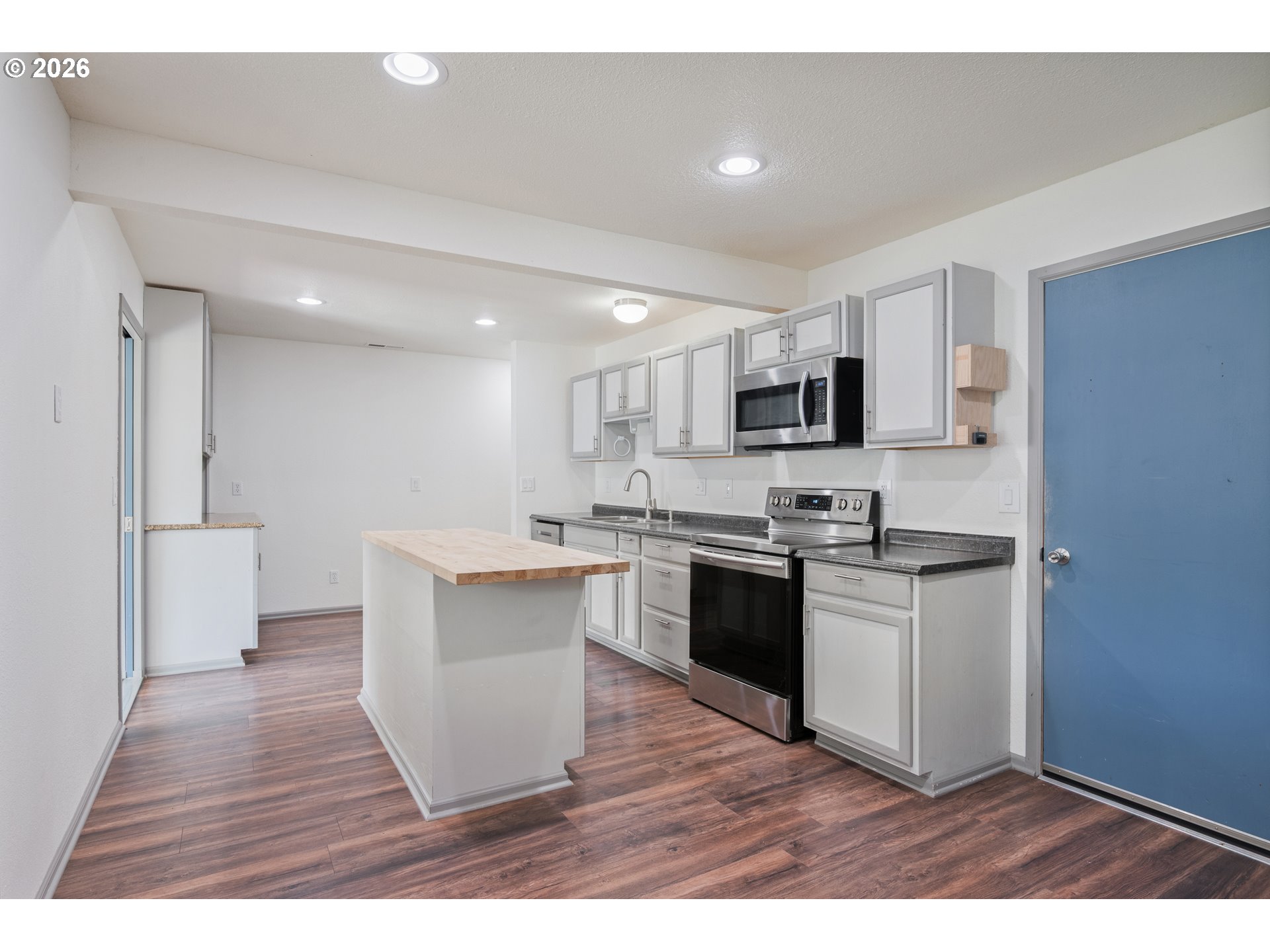 4703 Merlin Street Longview, WA 98632 - Photo 9 of 25 a kitchen with a sink and steel appliances
