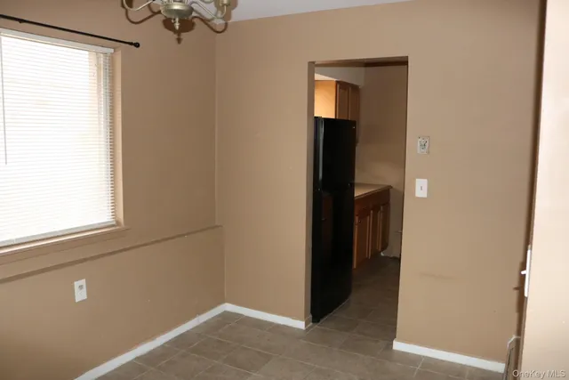 a view of a hallway with windows