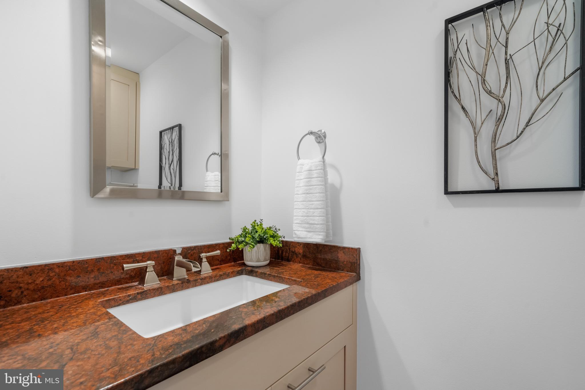 1625 Q Street Northwest, Unit 203 Washington, DC 20009 - Photo 11 of 33 a bathroom with a sink and a mirror