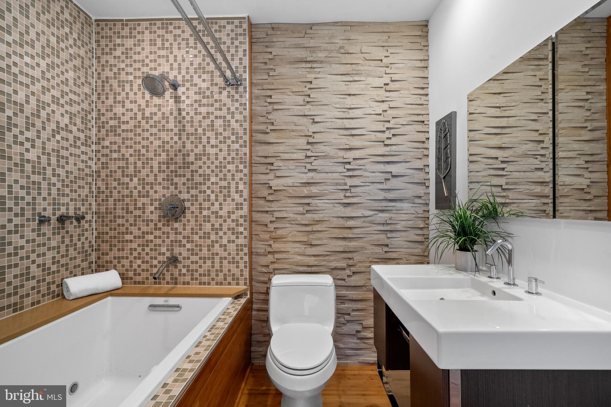1625 Q Street Northwest, Unit 203 Washington, DC 20009 - Photo 25 of 33 a bathroom with a sink a toilet and shower