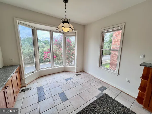 a view of entryway with window and chandelier