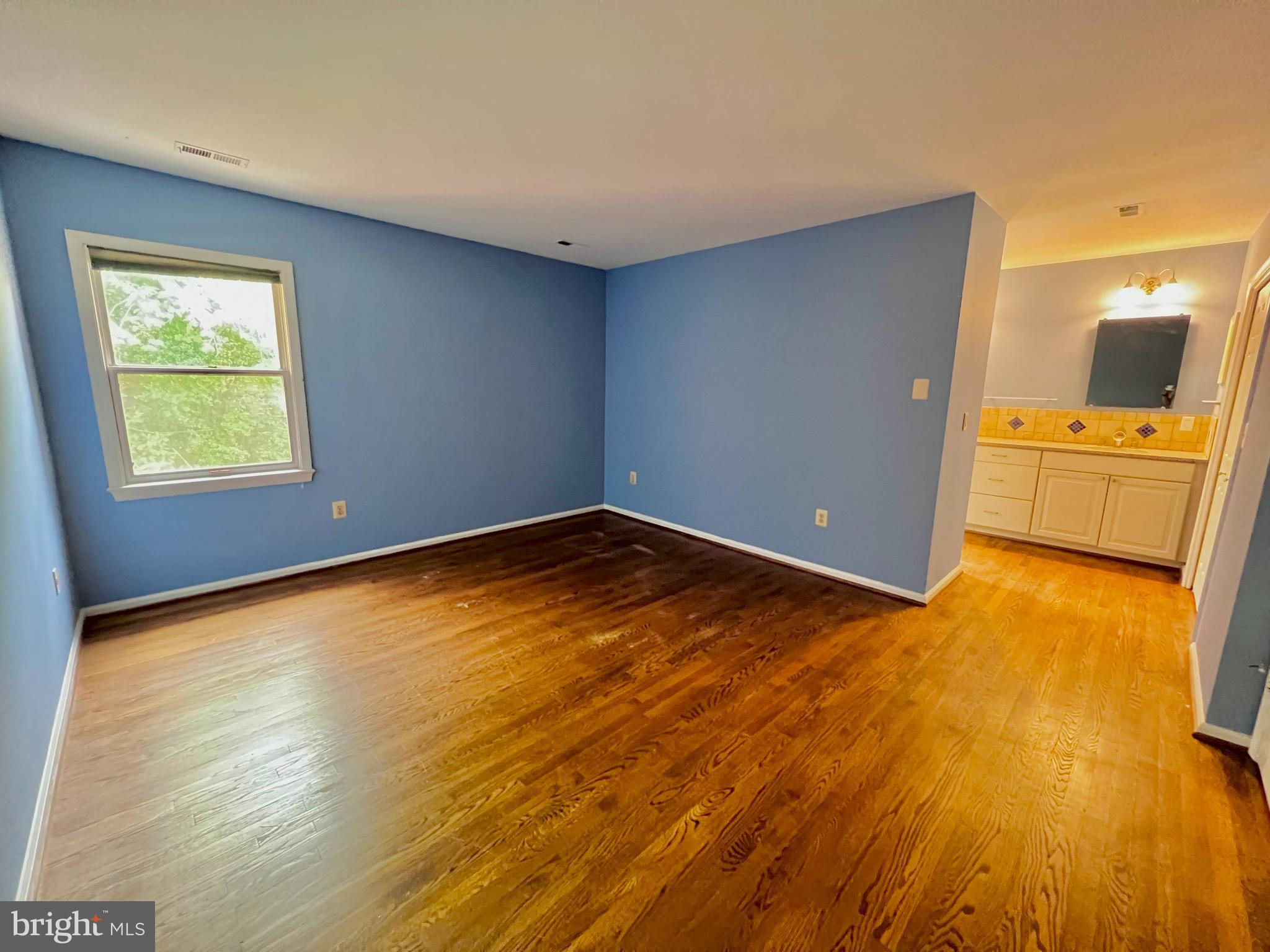 1445 Hampton Hill Circle McLean, VA 22101 - Photo 25 of 36 a view of empty room with window and wooden floor