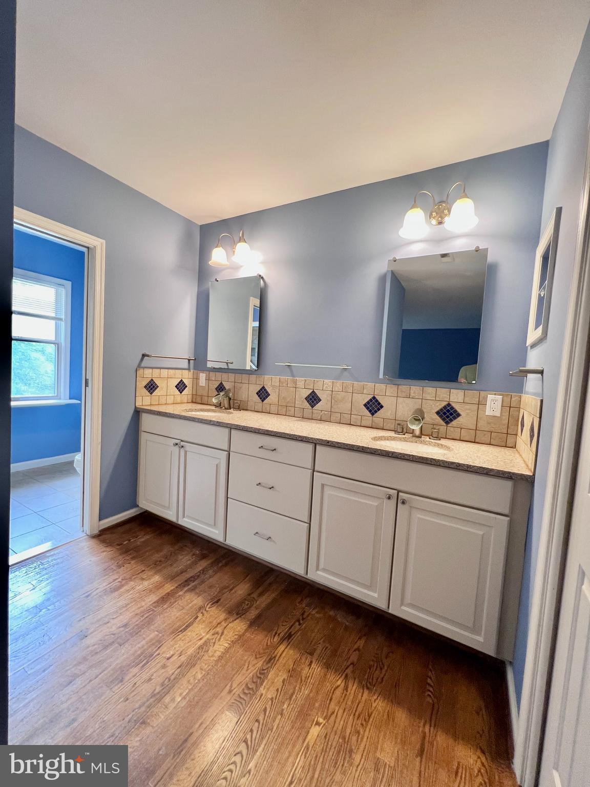 1445 Hampton Hill Circle McLean, VA 22101 - Photo 28 of 36 a spacious bathroom with a double vanity sink and mirror