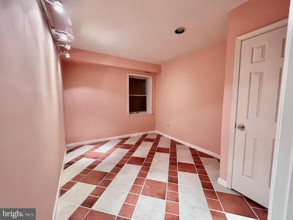 a view of a room with a black white checkered floor