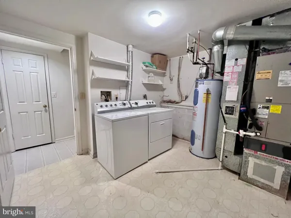 a kitchen with refrigerator and cabinets