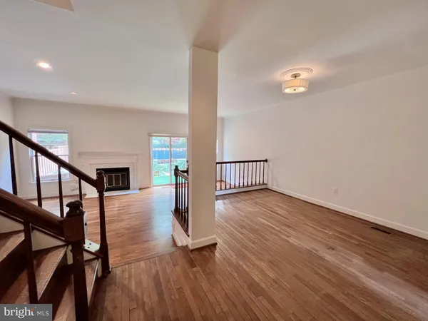 a view of an entryway with wooden floor