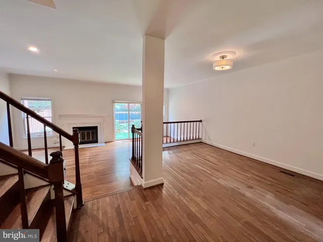 a view of an entryway with wooden floor