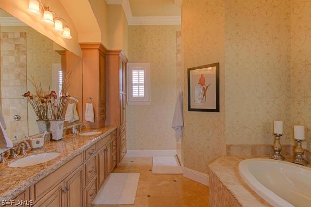 6005 West Riverside Drive Fort Myers, FL 33919 - Photo 13 of 24 a bathroom with a granite countertop sink mirror and a bathtub