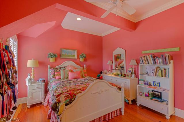 6005 West Riverside Drive Fort Myers, FL 33919 - Photo 22 of 24 a bed room with a bed and a book shelf