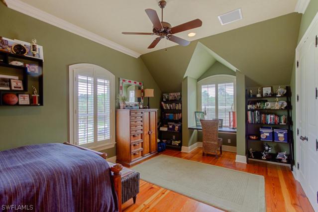 6005 West Riverside Drive Fort Myers, FL 33919 - Photo 23 of 24 a bed room with a bed and a book shelf