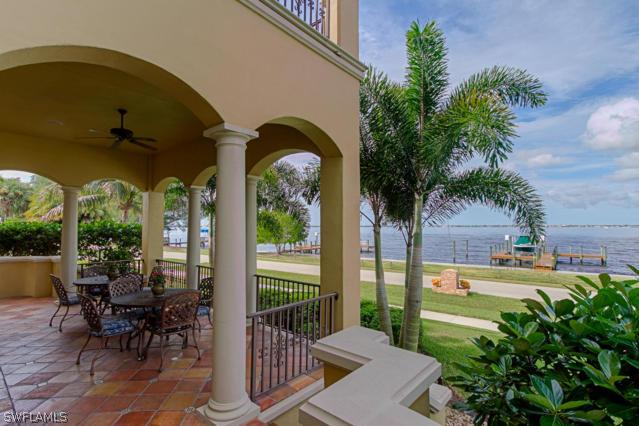 6005 West Riverside Drive Fort Myers, FL 33919 - Photo 3 of 24 a view of a porch with chairs and potted plants