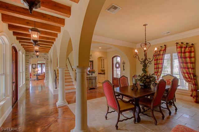 6005 West Riverside Drive Fort Myers, FL 33919 - Photo 4 of 24 a view of a dining room with furniture and chandelier