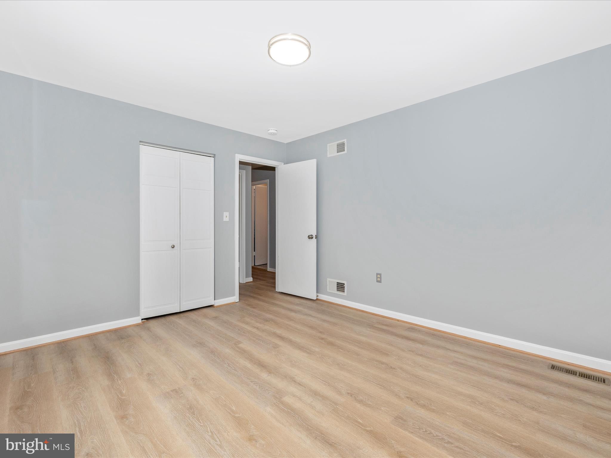 5154 Perry Road Mount Airy, MD 21771 - Photo 25 of 53 a view of an empty room with wooden floor