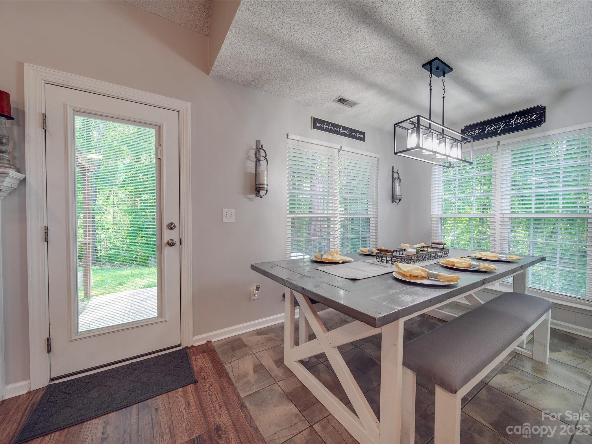 2349 Beaver Pond Road Kannapolis, NC 28083 - Photo 11 of 41 a view of a dining room with furniture window and wooden floor