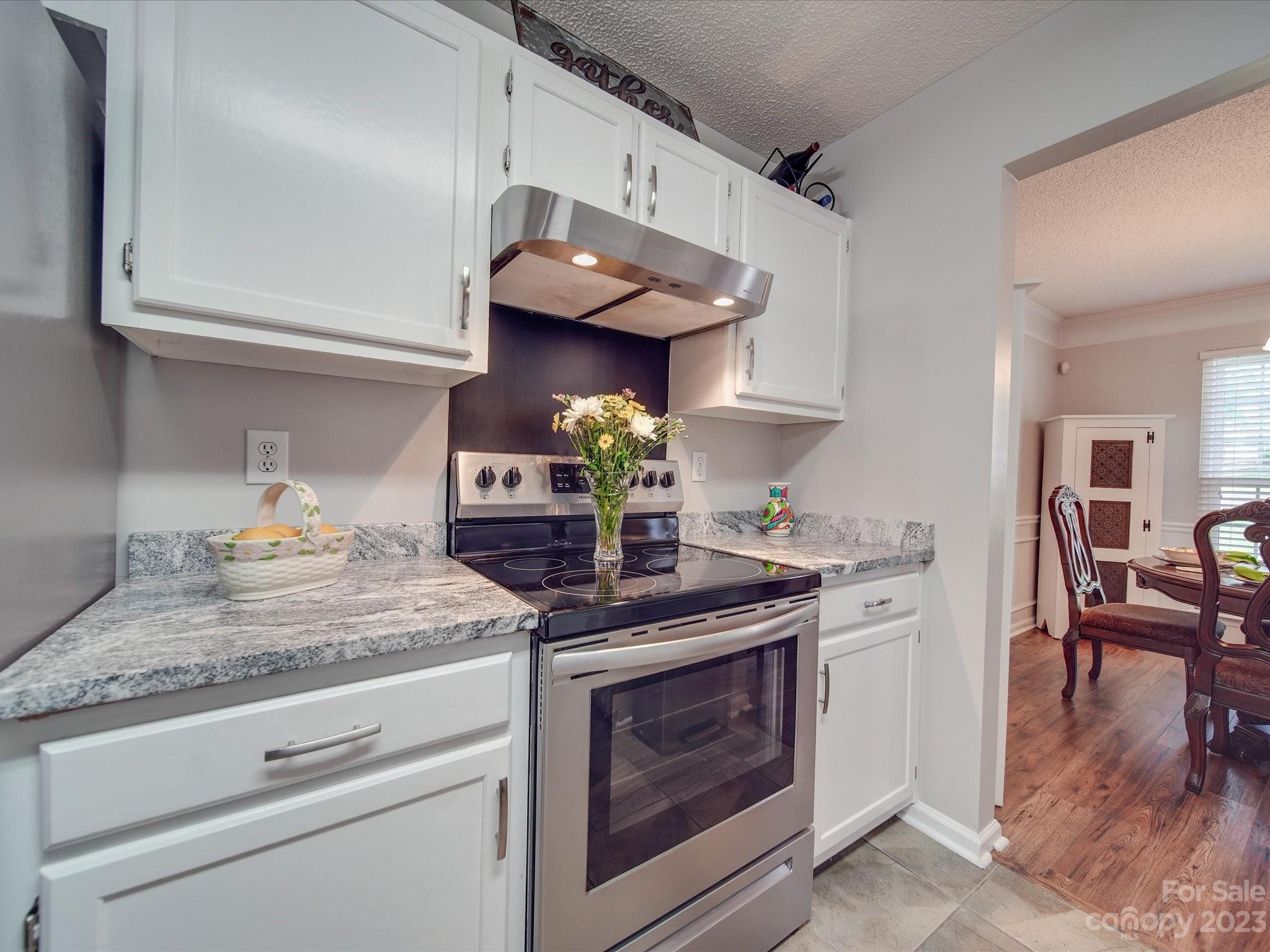 2349 Beaver Pond Road Kannapolis, NC 28083 - Photo 14 of 41 a kitchen with stainless steel appliances granite countertop a stove and a cabinets