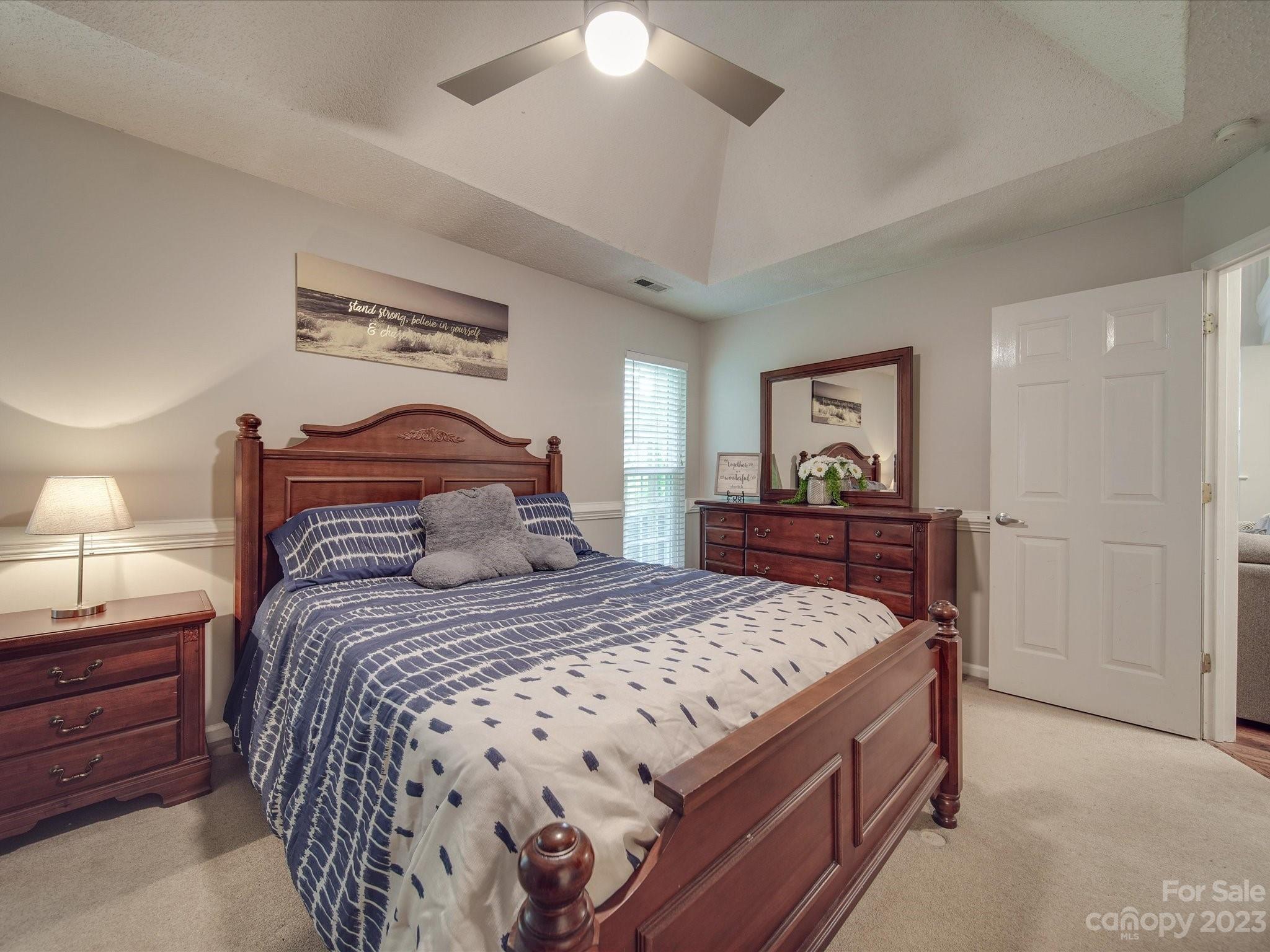 2349 Beaver Pond Road Kannapolis, NC 28083 - Photo 16 of 41 a bedroom with a bed and a lamp on dresser