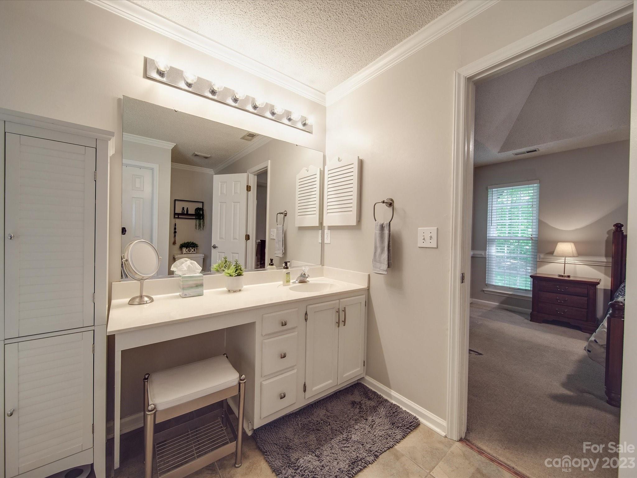 2349 Beaver Pond Road Kannapolis, NC 28083 - Photo 20 of 41 a en suite bathroom with a double vanity sink and a mirror