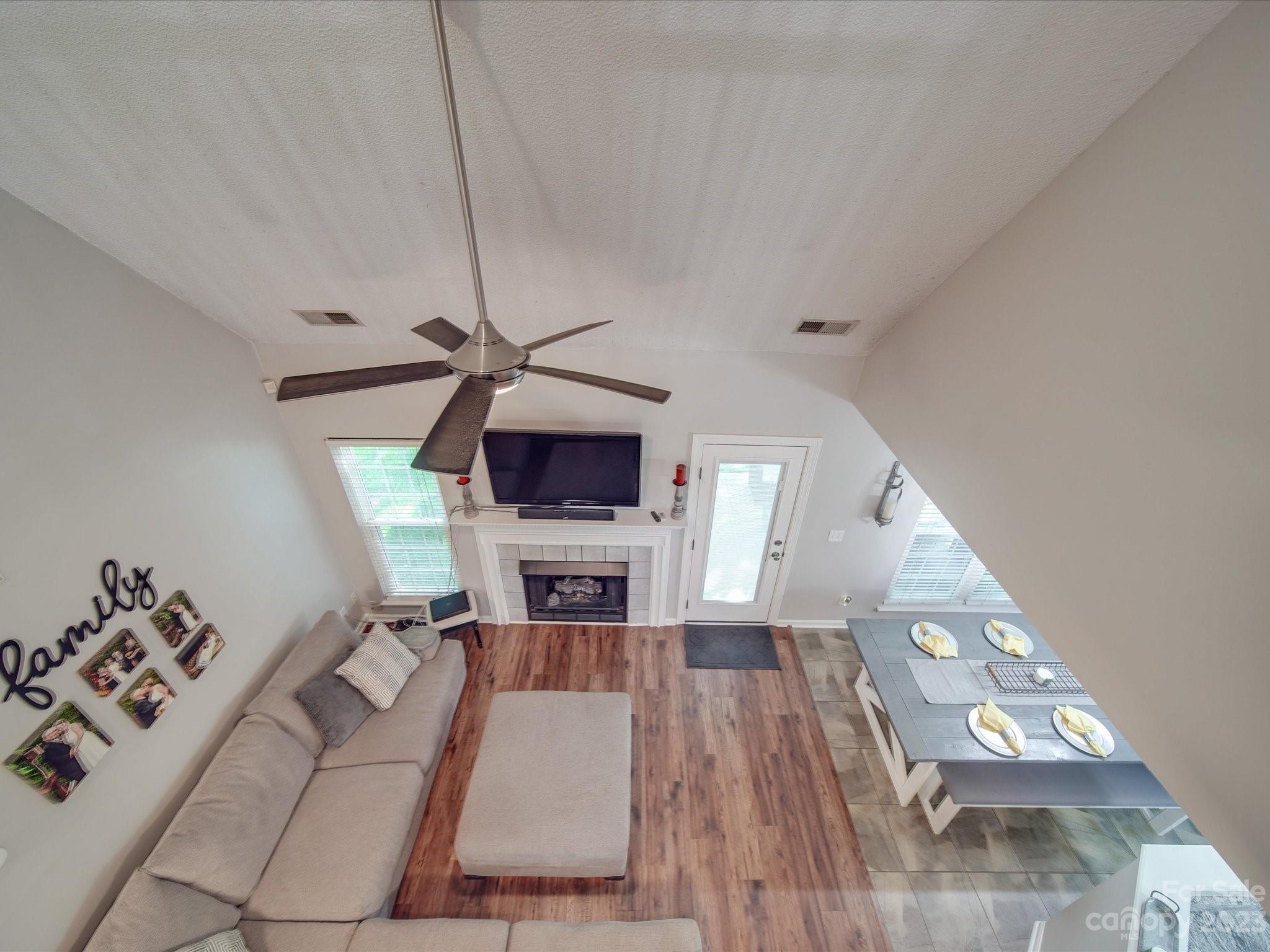 2349 Beaver Pond Road Kannapolis, NC 28083 - Photo 24 of 41 a living room with furniture and a flat screen tv