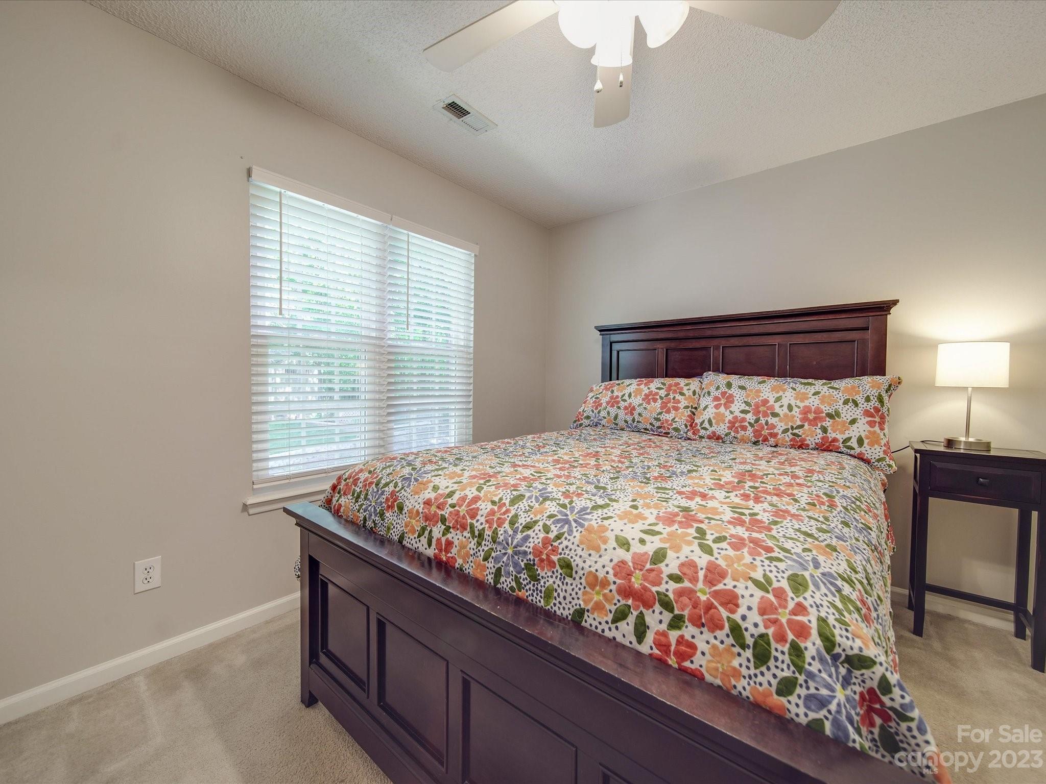 2349 Beaver Pond Road Kannapolis, NC 28083 - Photo 30 of 41 a bed sitting in a bedroom next to a window