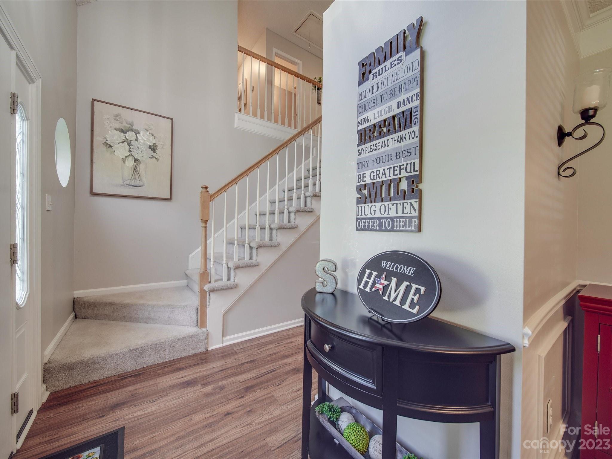 2349 Beaver Pond Road Kannapolis, NC 28083 - Photo 3 of 41 a view of a hallway to a house with wooden floor and stairs