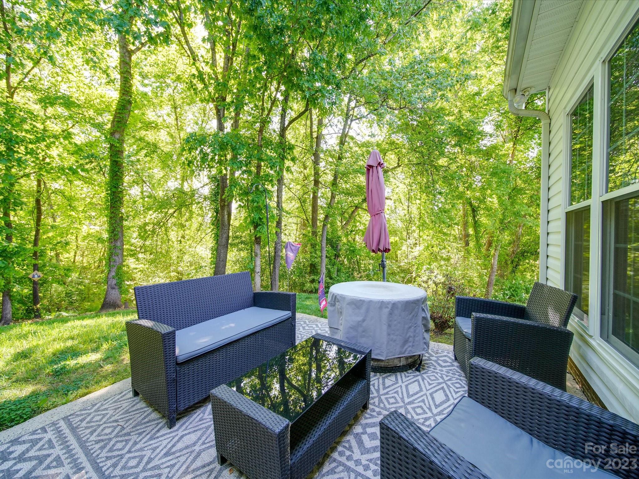 2349 Beaver Pond Road Kannapolis, NC 28083 - Photo 35 of 41 a view of a patio with couches table and chairs and potted plants