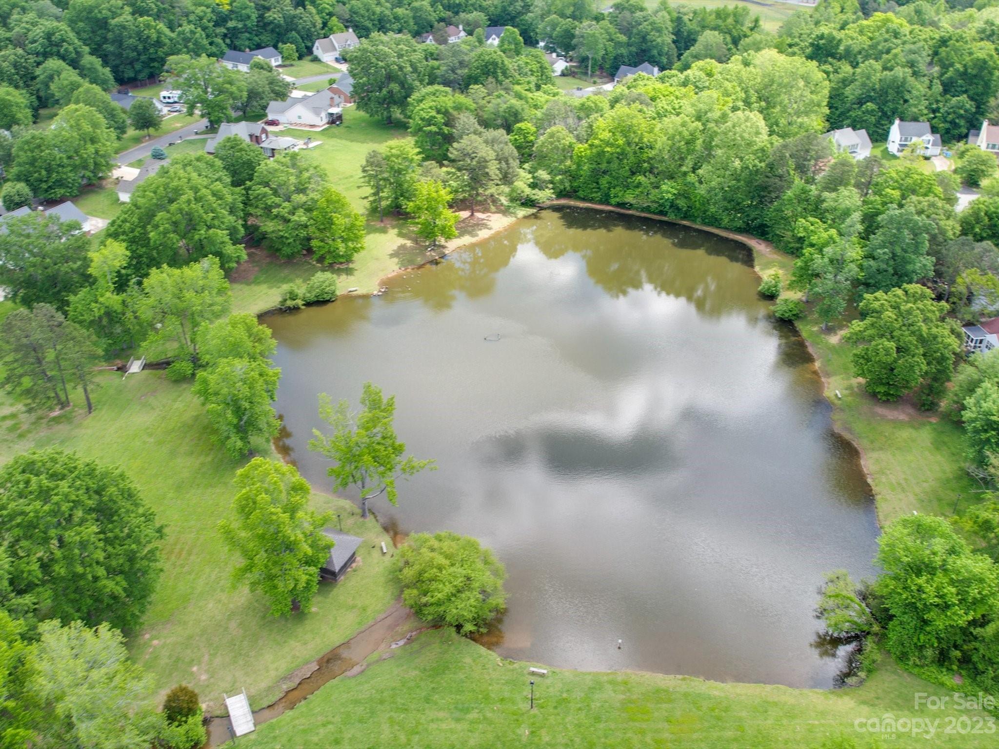 2349 Beaver Pond Road Kannapolis, NC 28083 - Photo 39 of 41 a view of a lake with a yard
