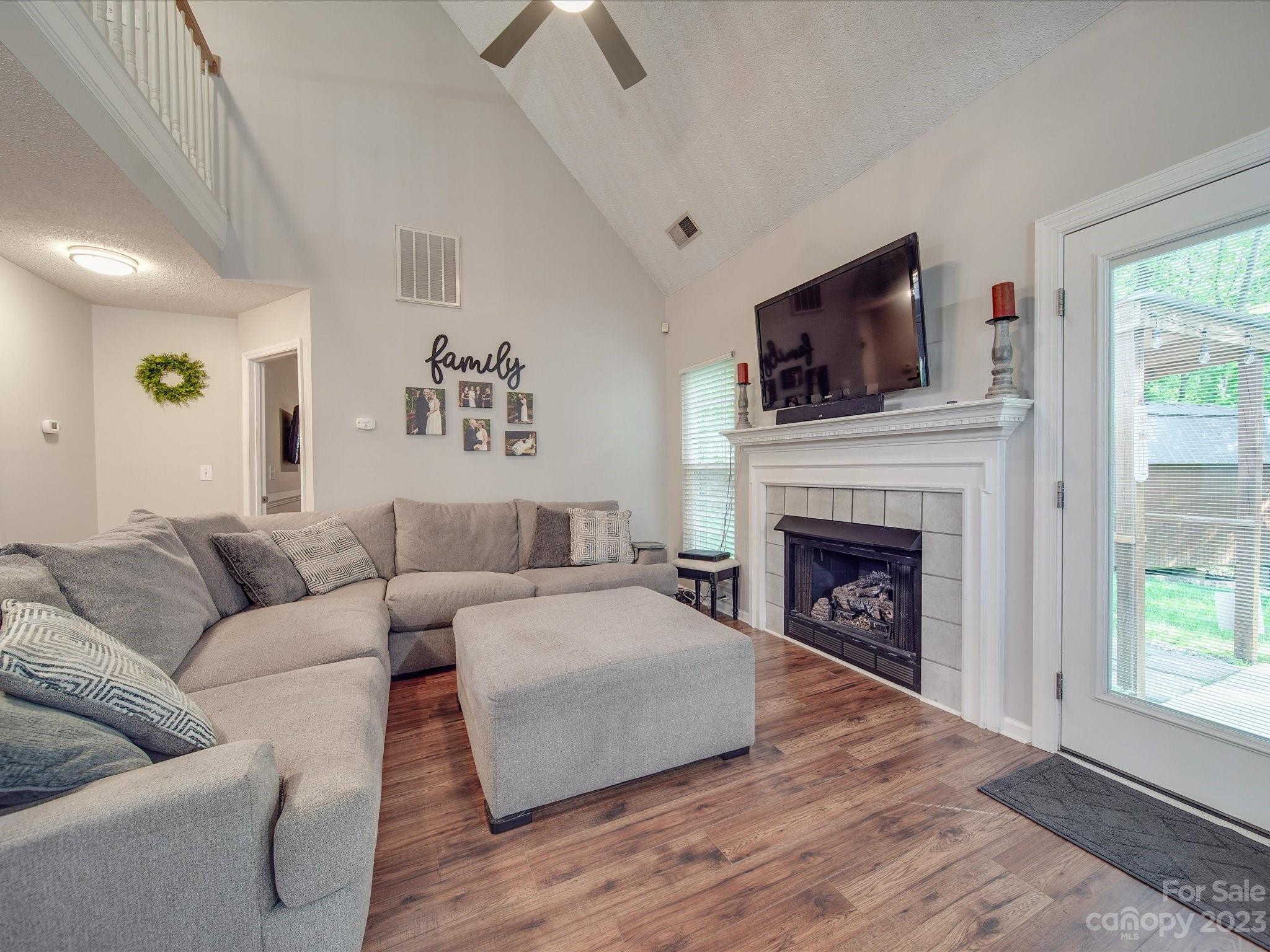 2349 Beaver Pond Road Kannapolis, NC 28083 - Photo 9 of 41 a living room with furniture and a fireplace