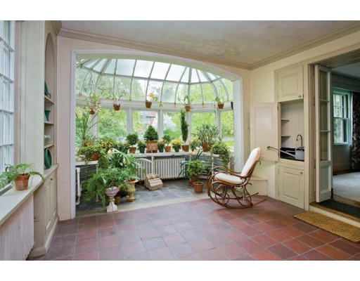 34 Spooner Road Brookline, MA 02467 - Photo 5 of 9 a living room filled with furniture and a potted plant