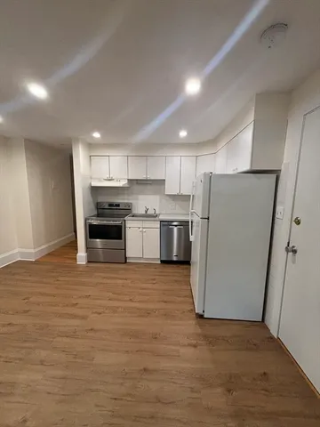 a view of kitchen with wooden floor