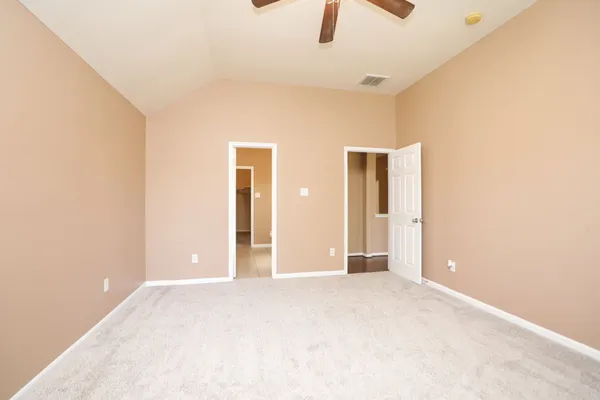 a view of an empty room with a window