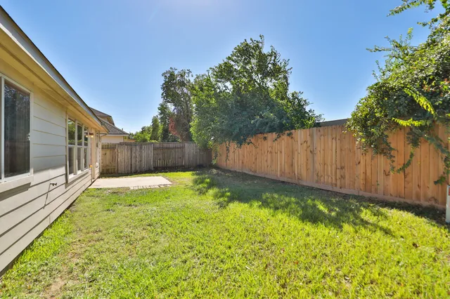 a view of back yard with green space
