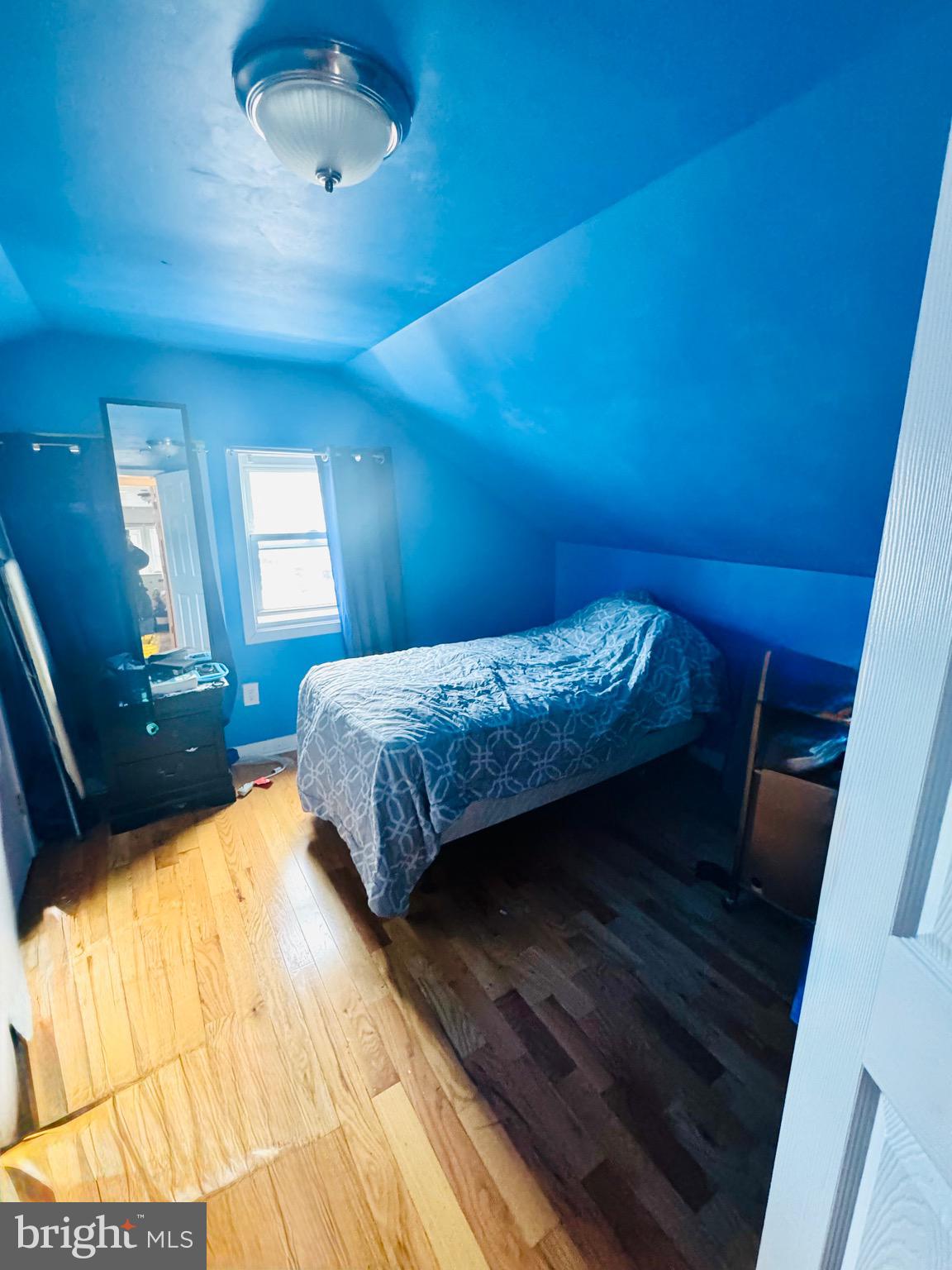 1968 William Street Union, NJ 07083 - Photo 17 of 43 a bedroom with a bed and a mirror