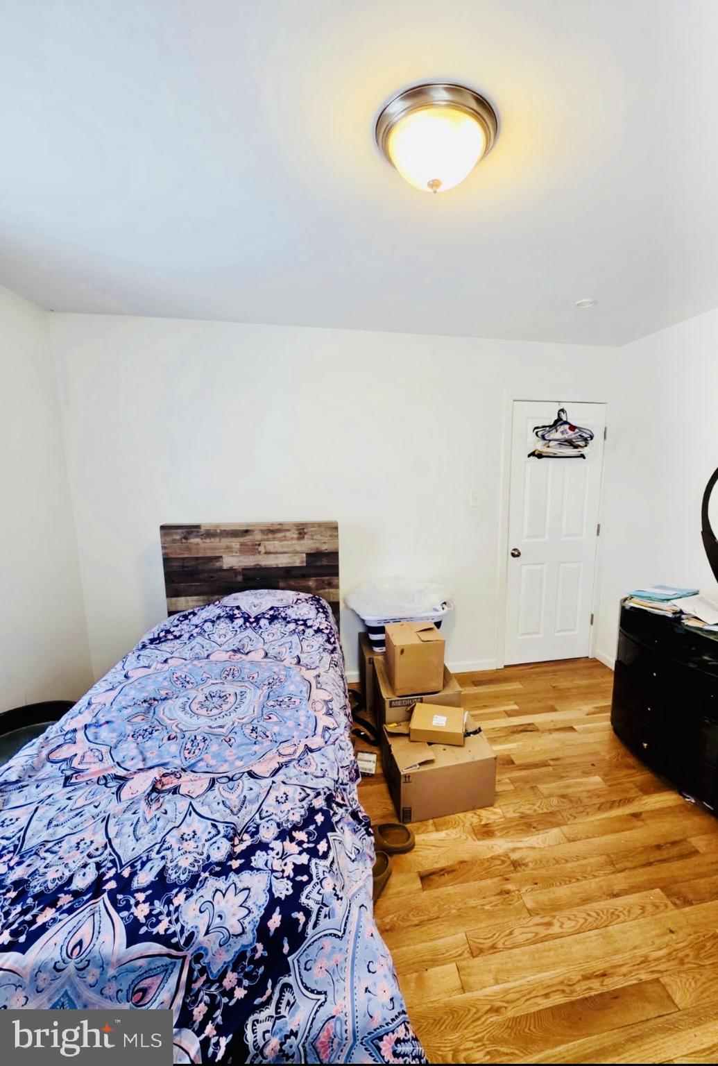 1968 William Street Union, NJ 07083 - Photo 19 of 43 a bedroom with a bed and a lamp
