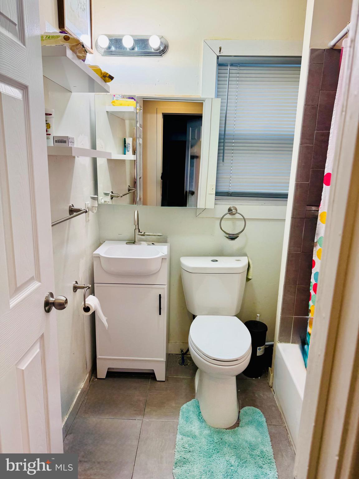 1968 William Street Union, NJ 07083 - Photo 20 of 43 a bathroom with a toilet sink and mirror