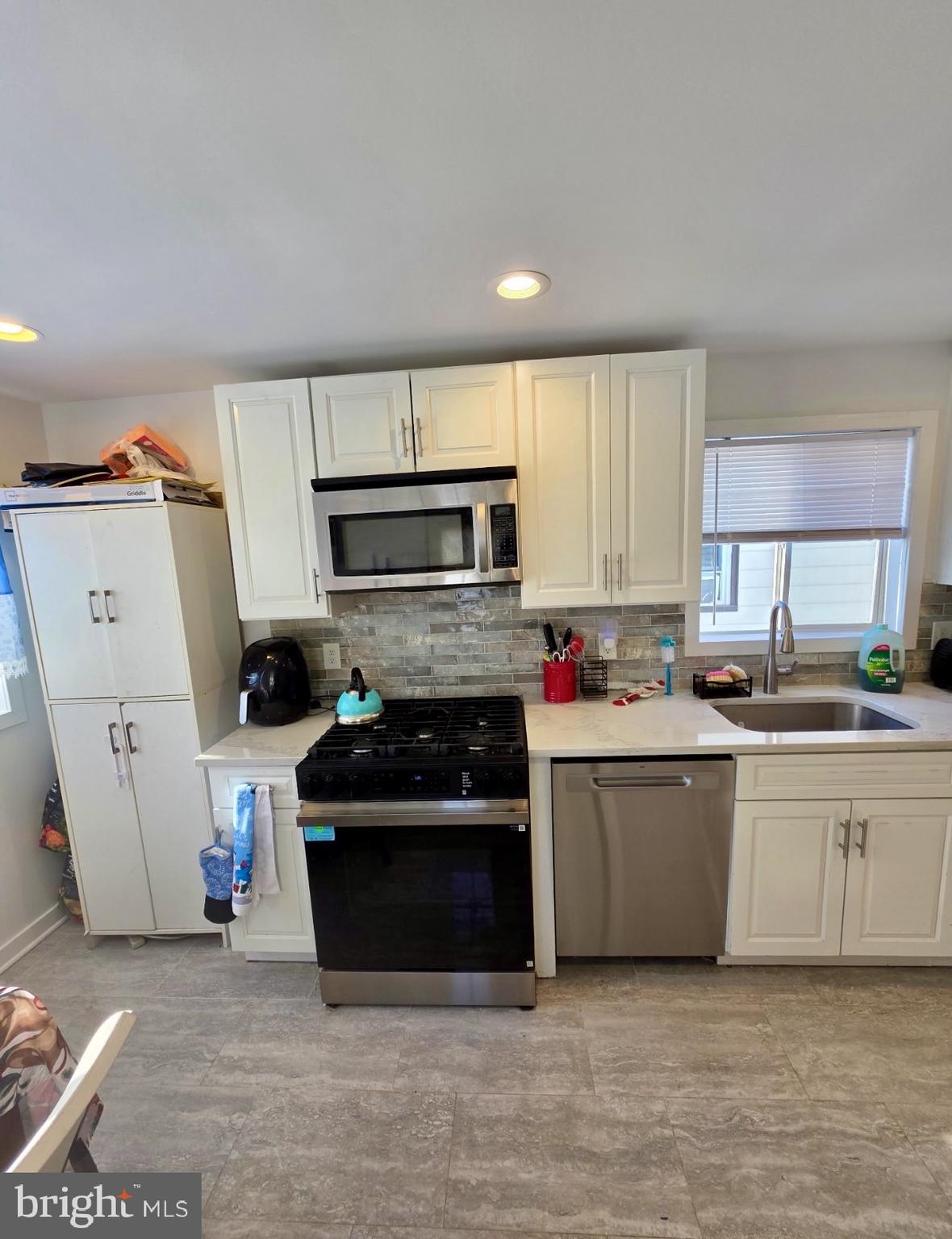 1968 William Street Union, NJ 07083 - Photo 22 of 43 a kitchen with a refrigerator and a stove top oven