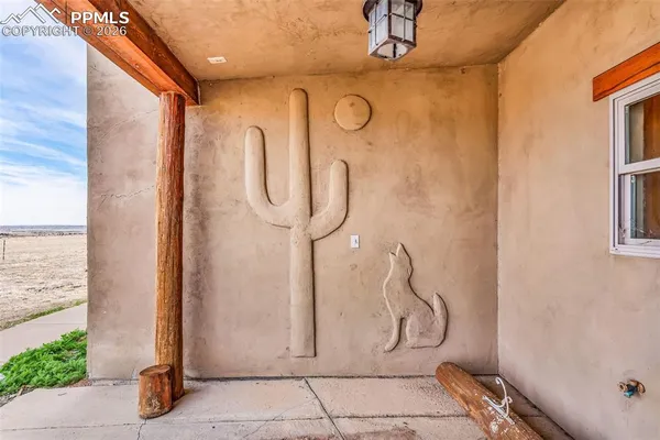 a view of front door and bedroom