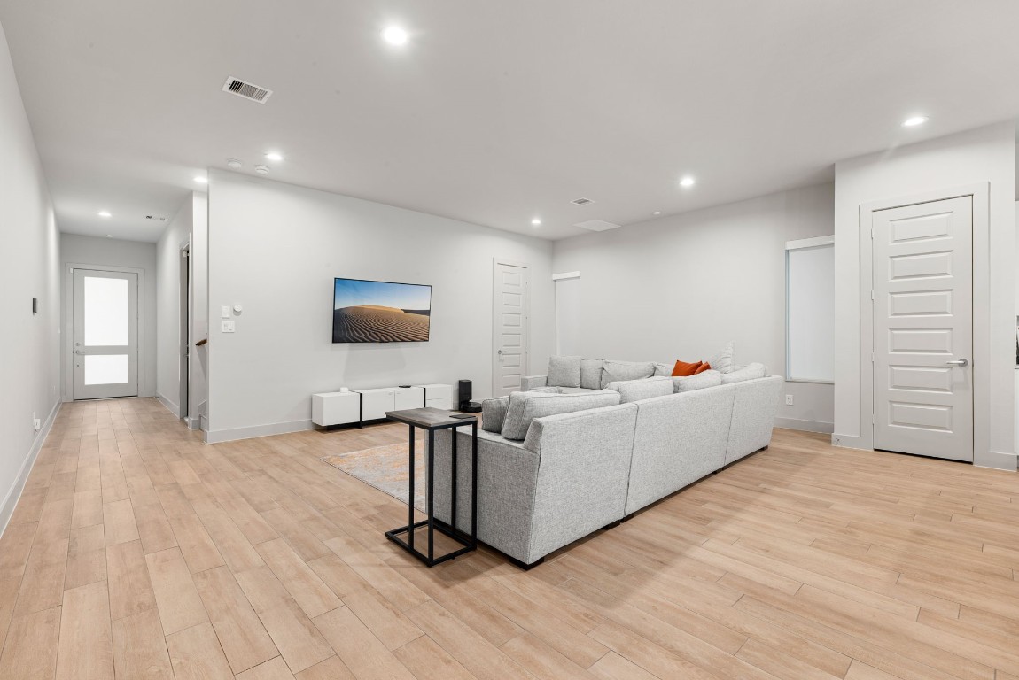 5722 Rucio Lane, Unit A Houston, TX 77092 - Photo 11 of 29 a living room with furniture and a flat screen tv