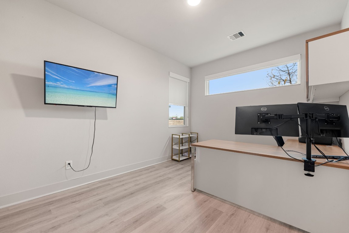 5722 Rucio Lane, Unit A Houston, TX 77092 - Photo 23 of 29 a living room with furniture and a flat screen tv