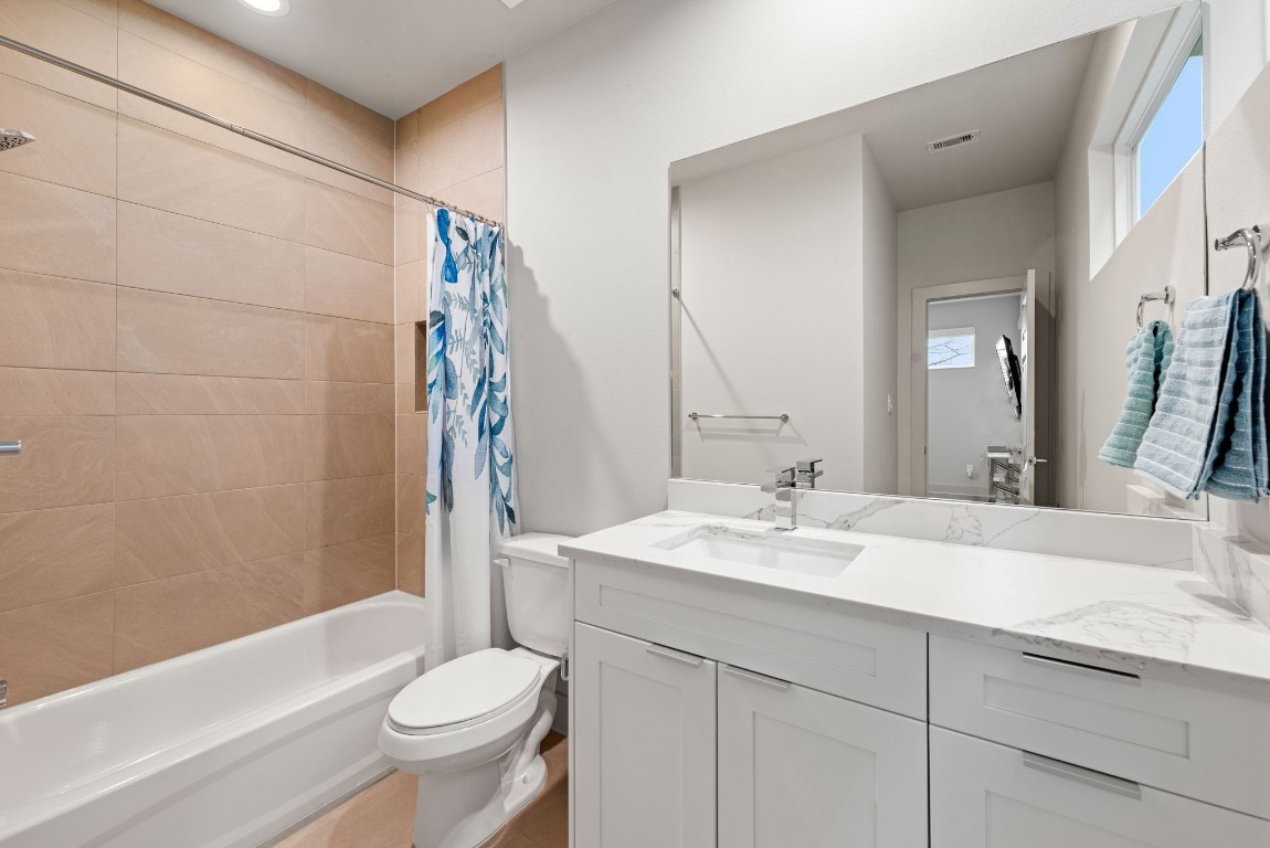 5722 Rucio Lane, Unit A Houston, TX 77092 - Photo 25 of 29 a bathroom with a sink toilet and shower