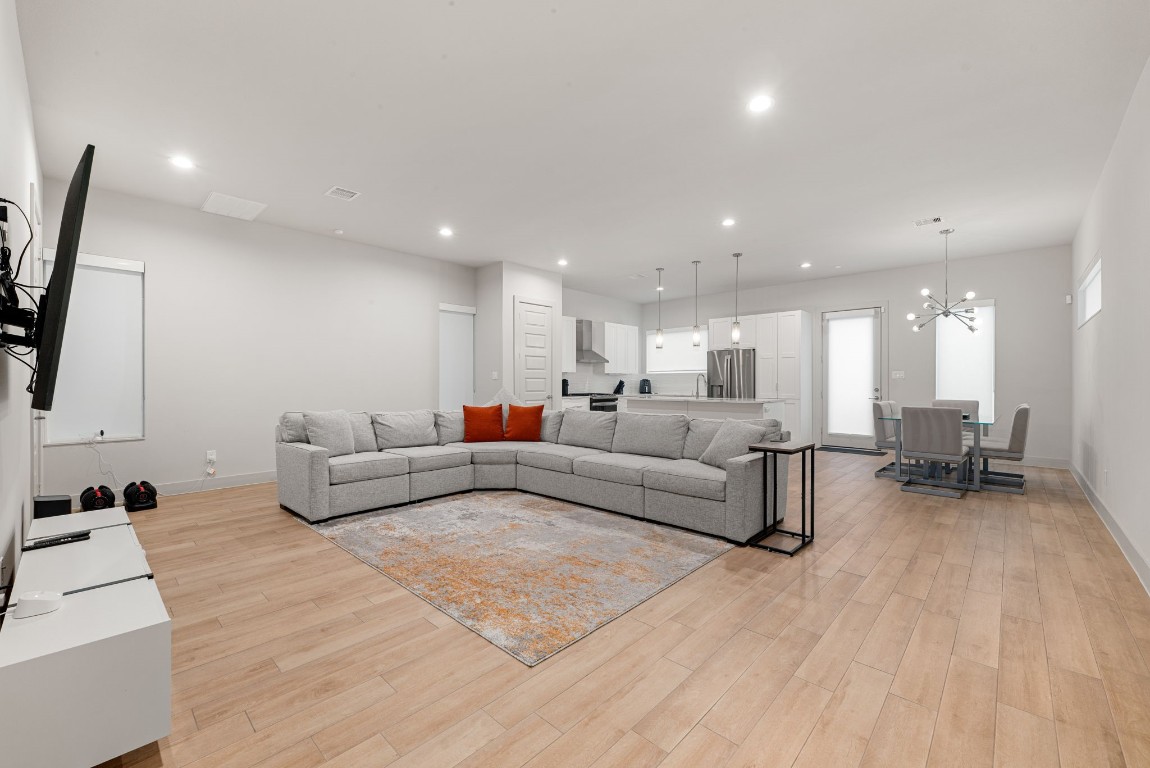 5722 Rucio Lane, Unit A Houston, TX 77092 - Photo 3 of 29 a living room with furniture and a flat screen tv