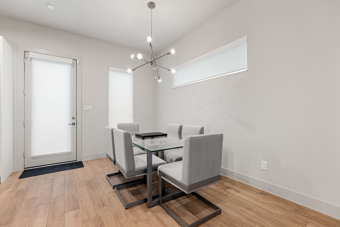 5722 Rucio Lane, Unit A Houston, TX 77092 - Photo 6 of 29 a view of a workspace with furniture and wooden floor