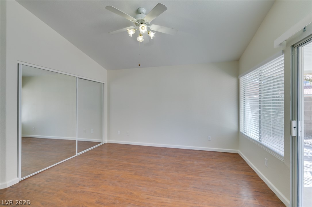 307 Cavalla Street Henderson, NV 89074 - Photo 37 of 44 Bright, open space with elegant wood flooring, large mirrored closets, and an inviting glass slider to the outdoors.
