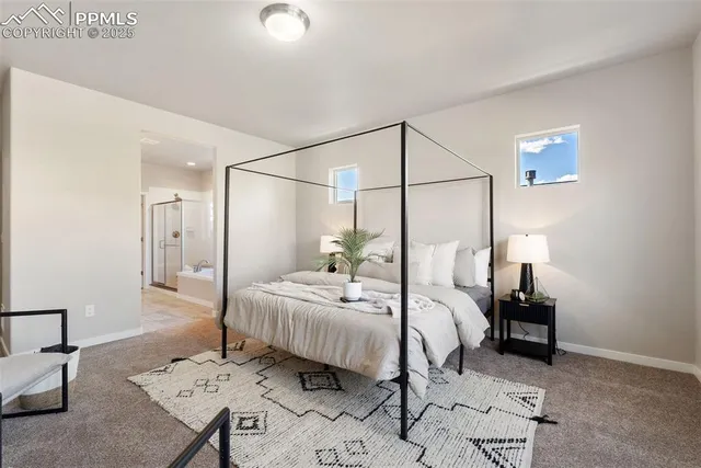 a bedroom with a bed and a table