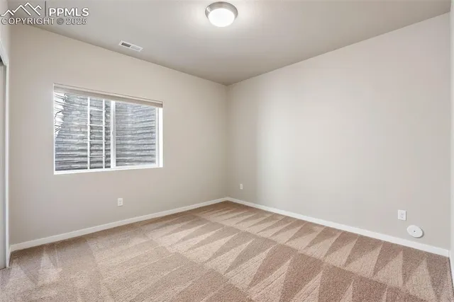 a bathroom with a sink a toilet a mirror and shower