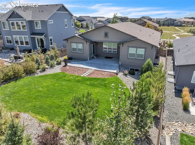 an aerial view of a house with a garden