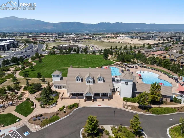 an aerial view of a house with outdoor space and lake view